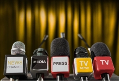 A set of press microphones in a row