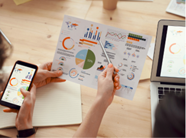 A report with analytics and graphs and a cellphone