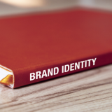 Book with Brand Identity on the fold.