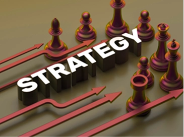 Blocks spelling out the word "Strategy" with chess pieces around it.